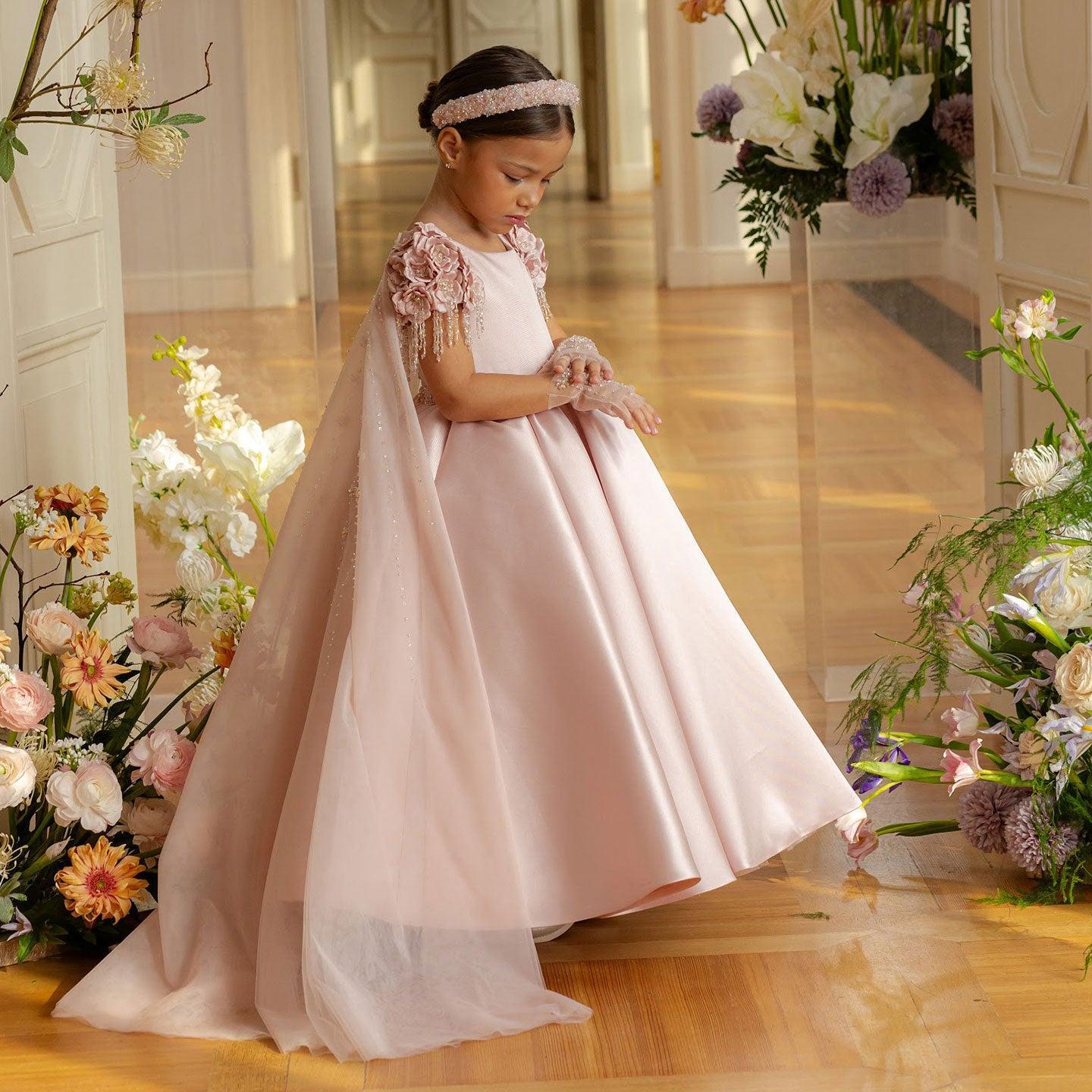 Dusty pink beaded flower girl dress with cap sleeves and handmade flowers