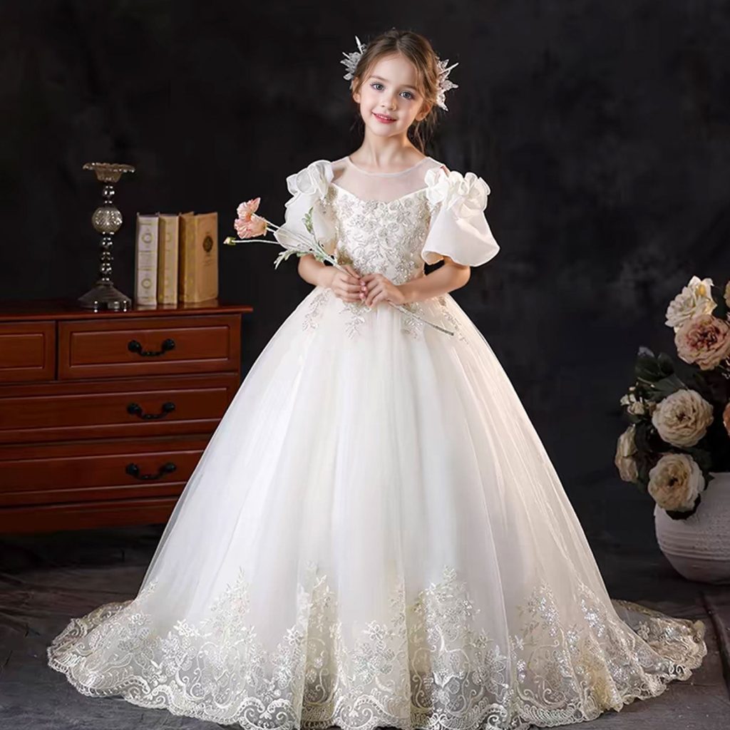 Off-white flower girl dress with lace appliques and a bow