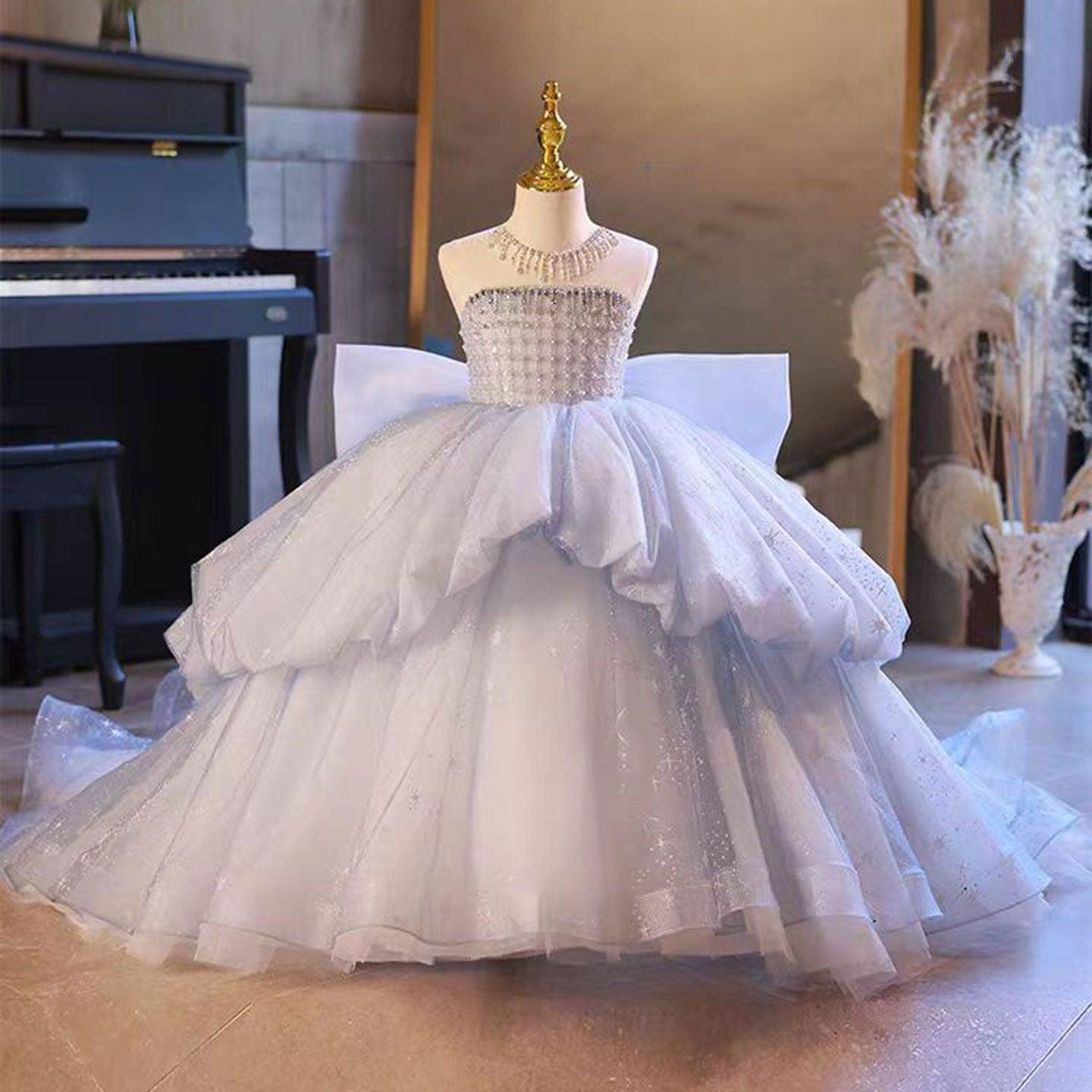 Crystal-beaded flower girl ball gown with a bow, in blue